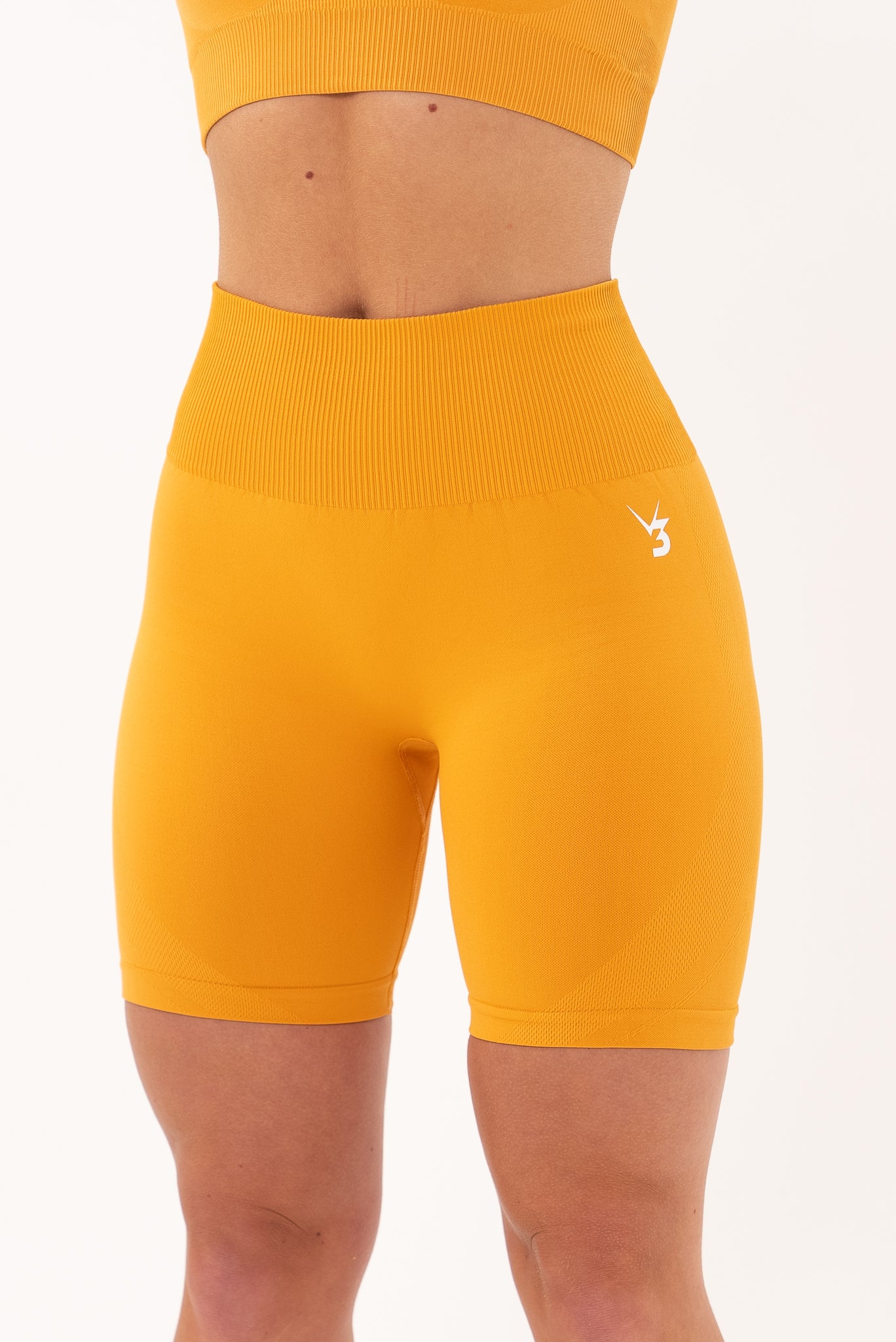 V3 Apparel Women's seamless Limitless high waisted cycle shorts in orange – Squat proof 5 inch inseam leg bum enhancing shorts for Gym workouts training, Running, yoga, bodybuilding and bikini fitness.